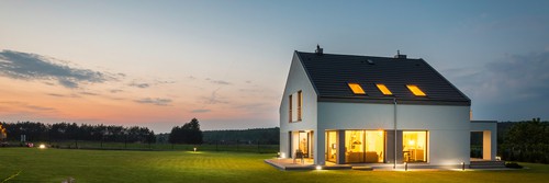 Panoramic Photo Of Modern House With Outdoor And Indoor Lighting