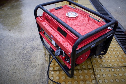 Electric Generator Used In The Rain On The Ground. Fuel