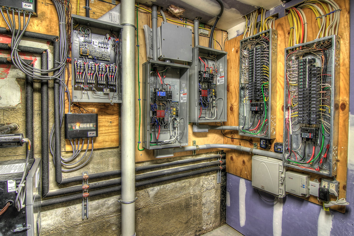 utility room with electrical panels.